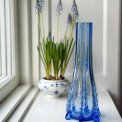 Light blue glass vase with feet, NB