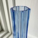Light blue glass vase with feet, NB