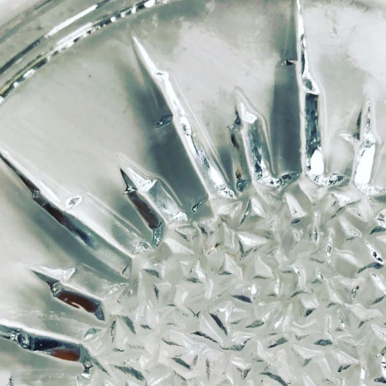 Clear glass, sun motif