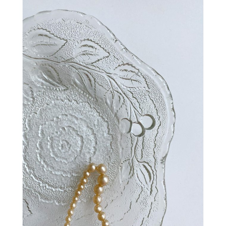 Clear glass, leaf-shaped with cherry impression