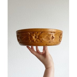 Wooden bowl with flower carving