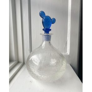 Clear carafe with bubbles and cactus cork