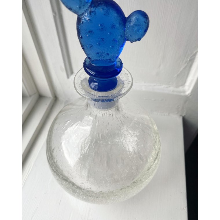 Clear carafe with bubbles and cactus cork