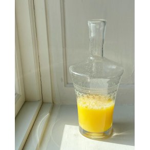 Clear glass carafe with intricate cuts