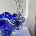Blue glass basket with clear handle and white edge