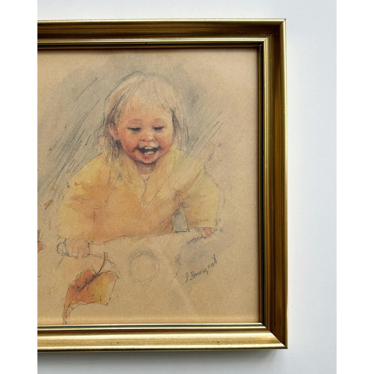 Child in gold frame, yellow jacket and scooter