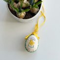 Easter egg with embroidered chicken and ribbon