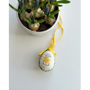 Easter egg with embroidered chicken and ribbon