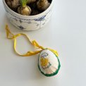 Easter egg with embroidered chicken and ribbon