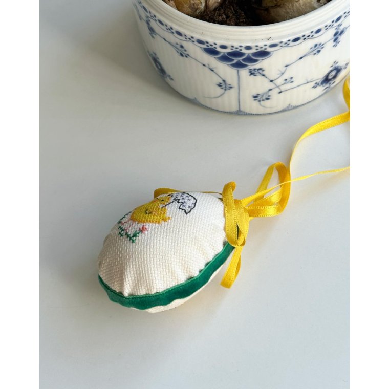 Easter egg with embroidered chicken and ribbon