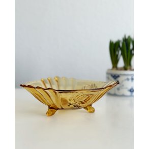 Amber-colored glass, notched with flowers and 3 feet, NB