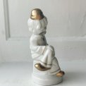 Porcelain figure, clown on dice, painted detail