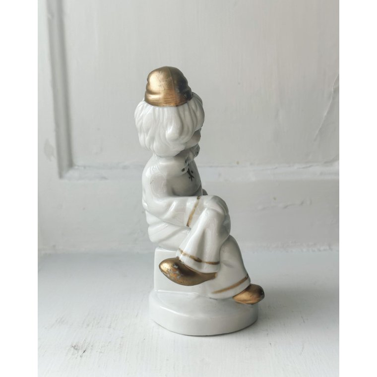 Porcelain figure, clown on dice, painted detail