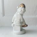 Porcelain figure, clown on dice, painted detail