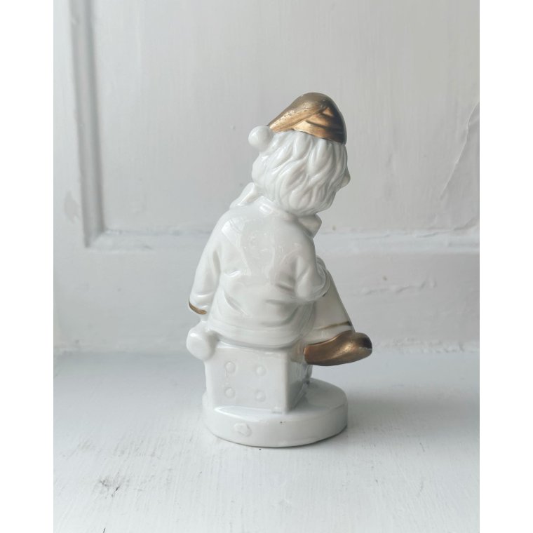 Porcelain figure, clown on dice, painted detail