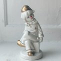 Porcelain figure, clown on dice, painted detail