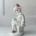 Porcelain figure, clown on dice, painted detail