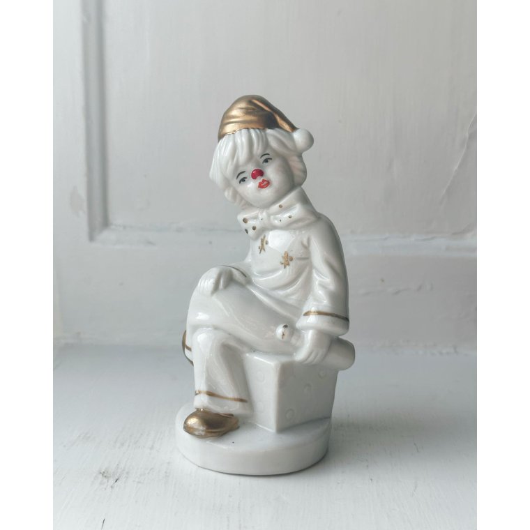 Porcelain figure, clown on dice, painted detail