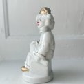 Porcelain figure, clown on dice, painted detail