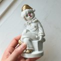 Porcelain figure, clown on dice, painted detail