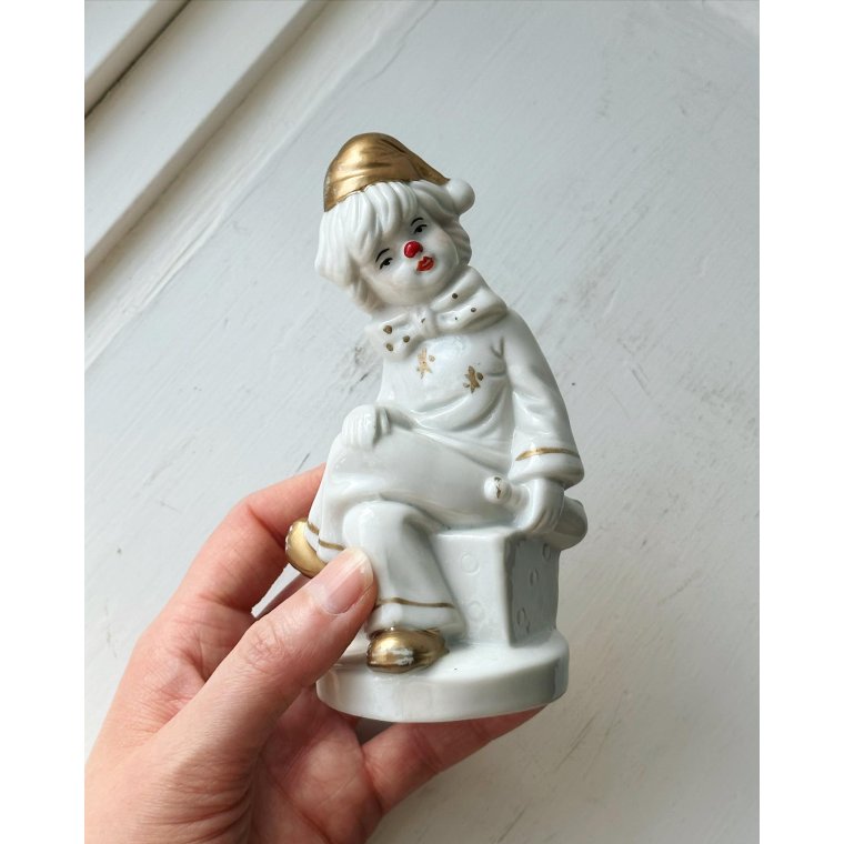 Porcelain figure, clown on dice, painted detail