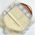 Pastel yellow fabric napkin w crocheted edge