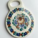 Polish faience coaster, round w handle, brown/blue/green