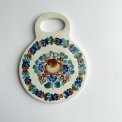 Polish faience coaster, round w handle, brown/blue/green