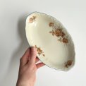 Small dish, off white w orange flowers and brue trim