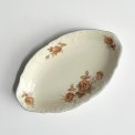 Small dish, off white w orange flowers and brue trim