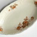 Small dish, off white w orange flowers and brue trim