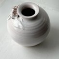 Small white sphere vase w ceramic flowers