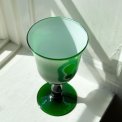 Cup on foot, white and green glass