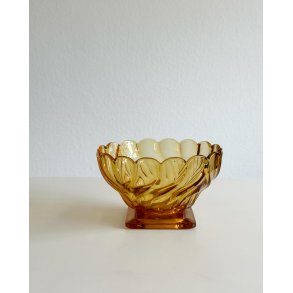 Amber colored glass bowl on foot