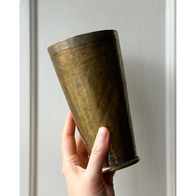Patinated metal cup w pattern