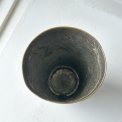 Patinated metal cup w pattern