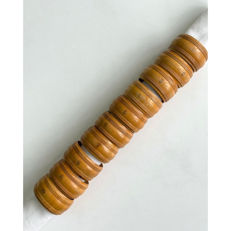 Set of wooden napkin rings, numbered