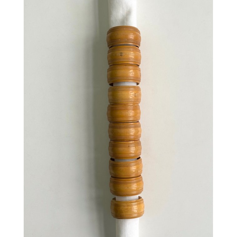 Set of wooden napkin rings, numbered