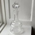 Clear glass, stopper with spheres, NB